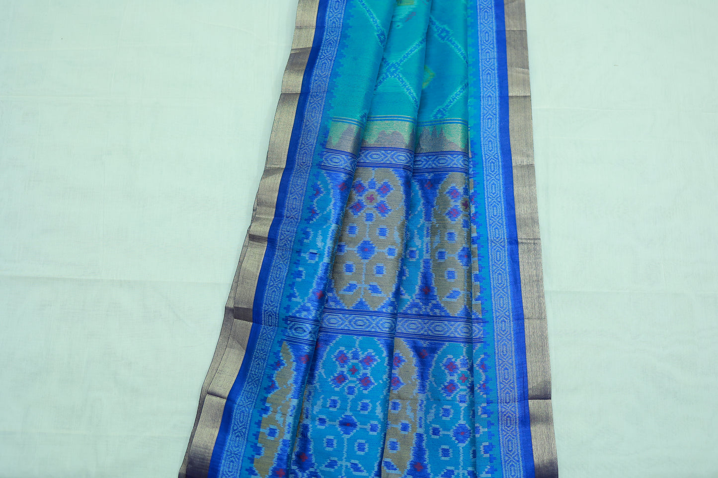 KS87 -A rich  teal or turquoise blue base Pochampally Ikat sarees